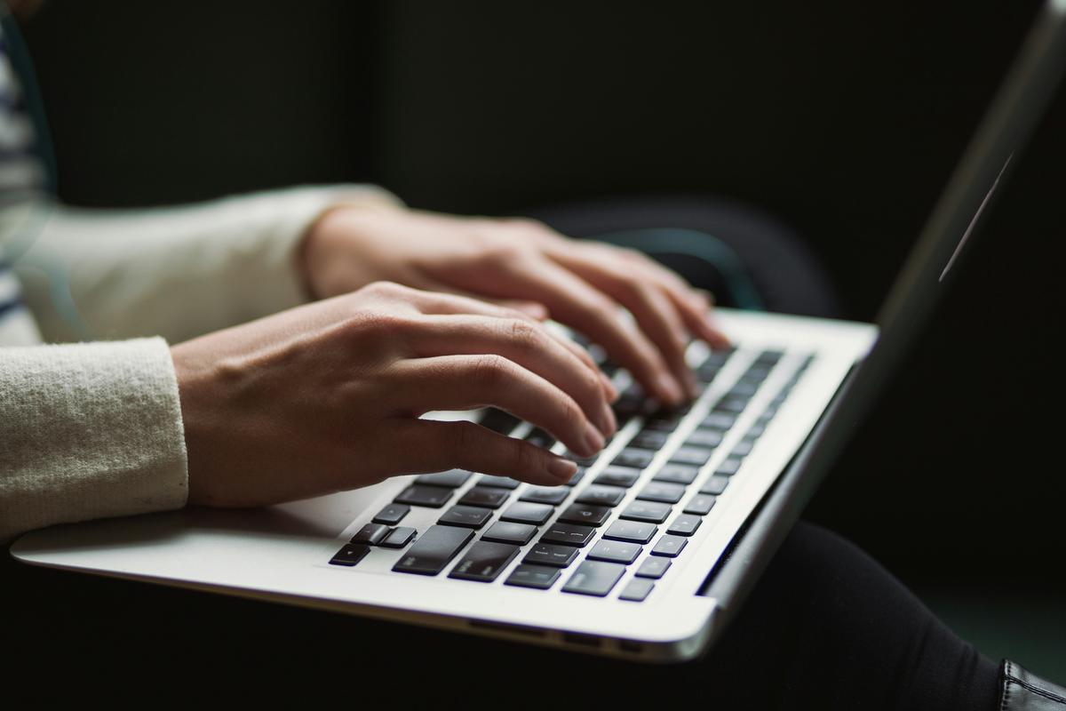 Image of a person writing on a laptop, representing affiliate marketing tips for success