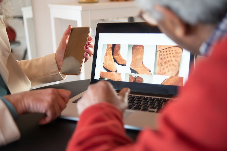 Image illustrating the concept of an e-commerce boom, with people using mobile devices to shop online