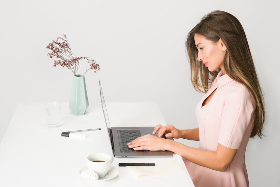 An image featuring a person working on a laptop with various icons representing online business strategies.