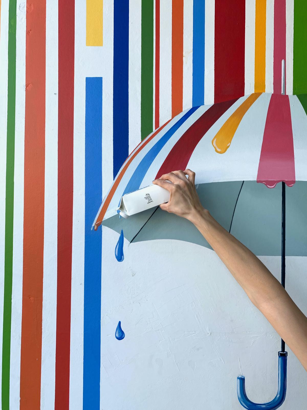 A person standing in front of a colorful background, representing personal branding